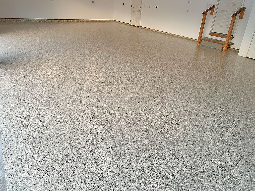 Polyaspartic coated tan garage floor